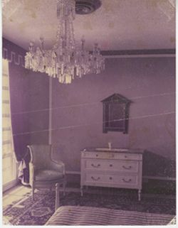 Chair, dresser, and chandelier in bedroom of Executive Mansion