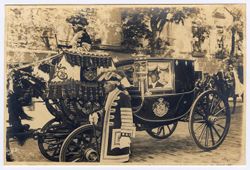 General Franco and guest riding inside a state carriage in procession