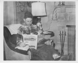 Bayh as young farmer reading