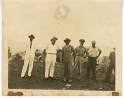 President William V. S. Tubman and four others pose for portrait on rocky ground
