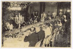 Guests seated at table for formal dinner