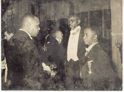 Secretary Grimes with men in formal attire