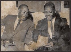 Dignitaries examine a piece of paper