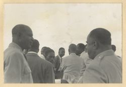 Group of men mingle together