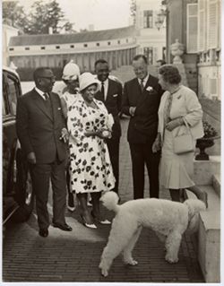President William V. S. Tubman, Mrs. Tubman and Coco Tubman stand with guests outside
