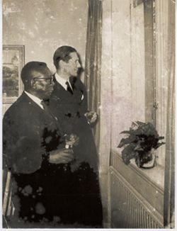 President William V. S. Tubman and Erland Waldenstr√∂m of Grangesberg Company and Swedish LAMCO Syndicate stand at window together