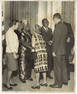 President William V. S. Tubman shakes hands with man in receiving line