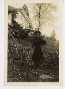 Wilhelmina "CooCoo" Tubman poses outdoors in front of home