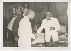 President William V. S. Tubman greets officials during a black tie event