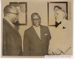 Mr. Henry de Torrente, Minister, Legation of Switzerland stands with two others