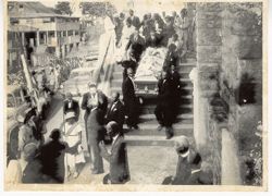 Funeral procession and coffin leaving church
