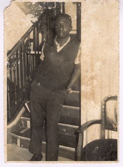 Man posed in front of stairs