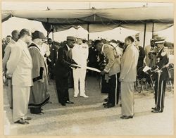 President William V. S. Tubman hands object to man during his farewell at George VI Memorial Park