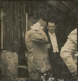 Guests gathers in formal attire during a reception