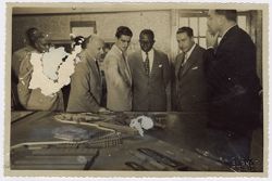 President Tubman observing a model with other dignitaries