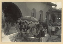 Guests mingle together at party