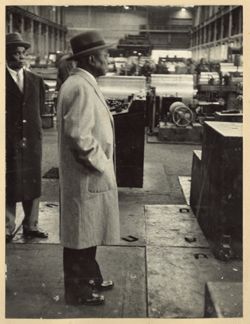 President William V. S. Tubman stands in factory during tour of the Republic Steel Corporation plants