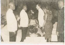 President William V. S. Tubman stands to talk with guests during a fromal event