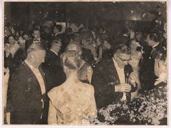 Guests at formal party mingle