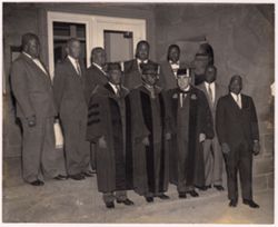 President William V. S. Tubman poses in a cap and gown with officials from Fairleigh Dickinson University and other dignitaries