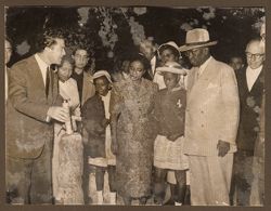 Top official explaining a point to President Tubman