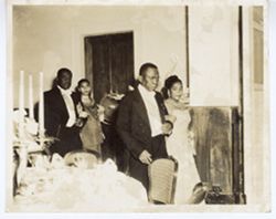 President William V. S. Tubman escorts Madame Yolette Leconte Magloir,e and President Paul E. Magloire escorts Mrs. Ruth Brewer at a reception during the state visit to Haiti