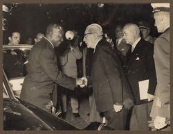President William V. S. Tubman shakes a dignitary's hand upon exiting a car