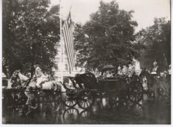 President William V. S. Tubman and Queen Juliana in carriage in parade with men in uniform on horses following
