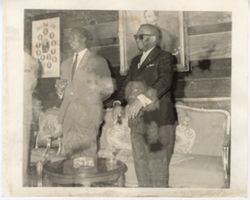 President William V. S. Tubman stands next to a guest in a sitting room