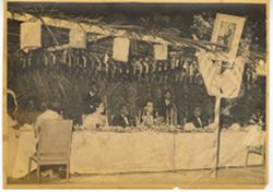 Guests, table and decorations at formal dinner table