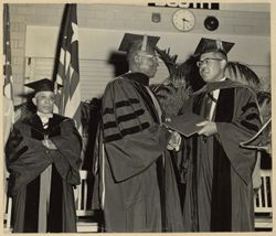 Morgan State College President Martin D. Jenkins presents President William V. S. Tubman with an honorary LL.D. degree