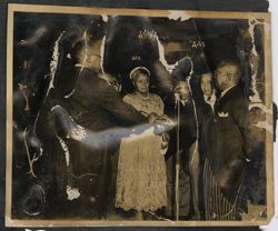President Tubman and a dignitary hold a book