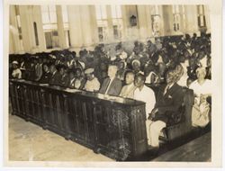 Congregation in pews during religious service