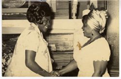 Mrs. Tubman shaking hands with another woman