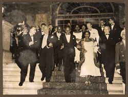 President and Mrs. Tubman  descending stairways to reception