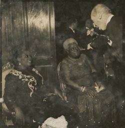 Mrs. Antoinette Tubman sits with Mary Jane McCleod Bethune while speaking to a guest