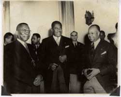 President William V. S. Tubman and officials in formal attire at a reception