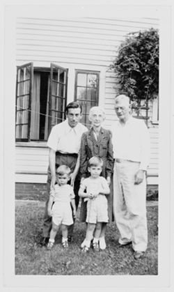Two pictures: a) Ma Robison with quilt, sitting on steps. b) Hoagy, Grandma Carmichael, Howard, Randy, and Hoagy Bix Carmichael posing in front of a house, early 1940s.