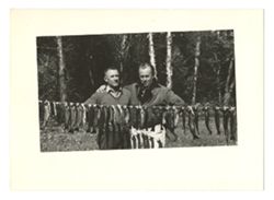 Roy Howard and companion posing with fish