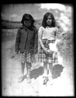 Two Indian girls, near Taos pueblo church