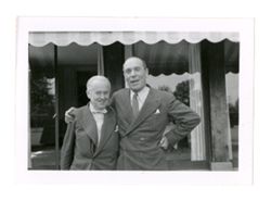 Roy Howard smiles with man