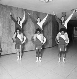 IU South Bend cheerleaders practice stunts and lifts, 1970s