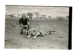 Man holds oryx carcass
