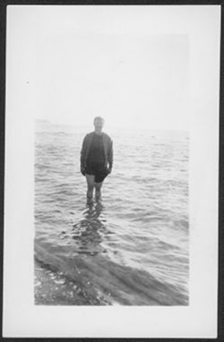 Friend of Martha Carmichael's standing in a lake.
