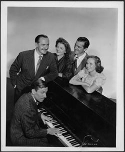 Hoagy Carmichael (at piano) in publicity still with four members of the cast of the film Best Years of Our Lives.