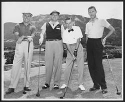 Hoagy Carmichael posing with three unidentified men on a golf course, early 1950-1951.