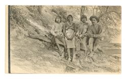 Group of people sitting on a tree