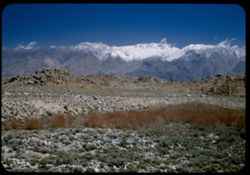 Across Owens Valey to snow-capped Inyo Mtns. From Mt. Whitney road above Lone Pine, Calif.