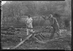 Marion Chafin and daughter sawing wood