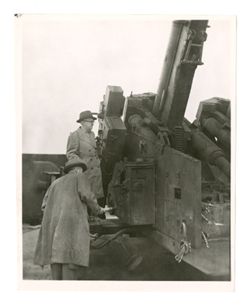 Roy Howard with large military weapon